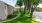 outdoor grassy area with a sidewalk